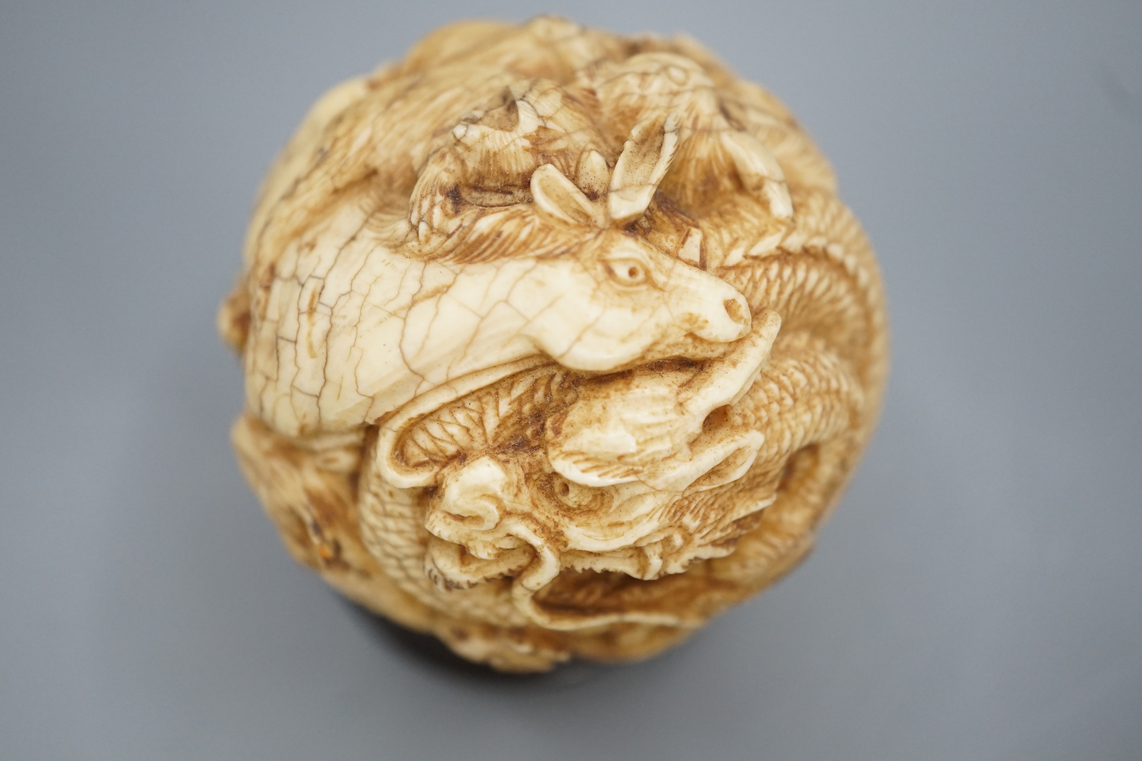 A Japanese ivory ‘Zodiac animal’ ball, early 20th century, 5cm